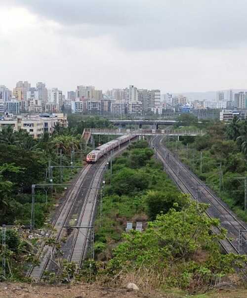 CBD Belapur_a train on a train track in a city